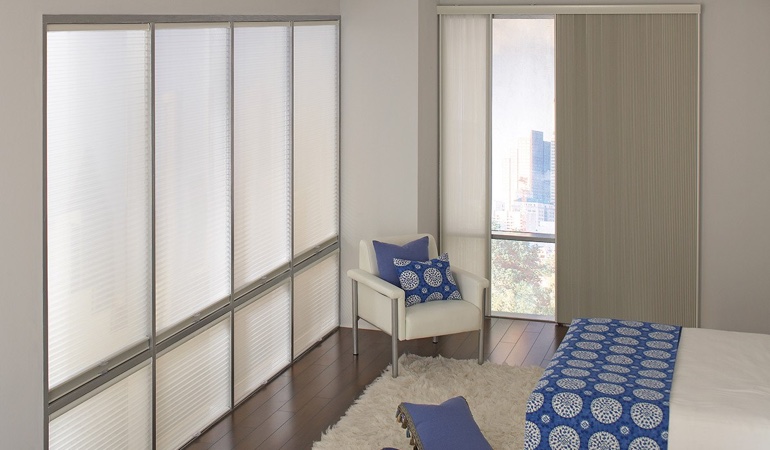 Cell shades are another choice to reflect a minimalist design. Cellular shades in a modern bedroom.