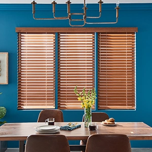 Wood blinds in a blue dining room